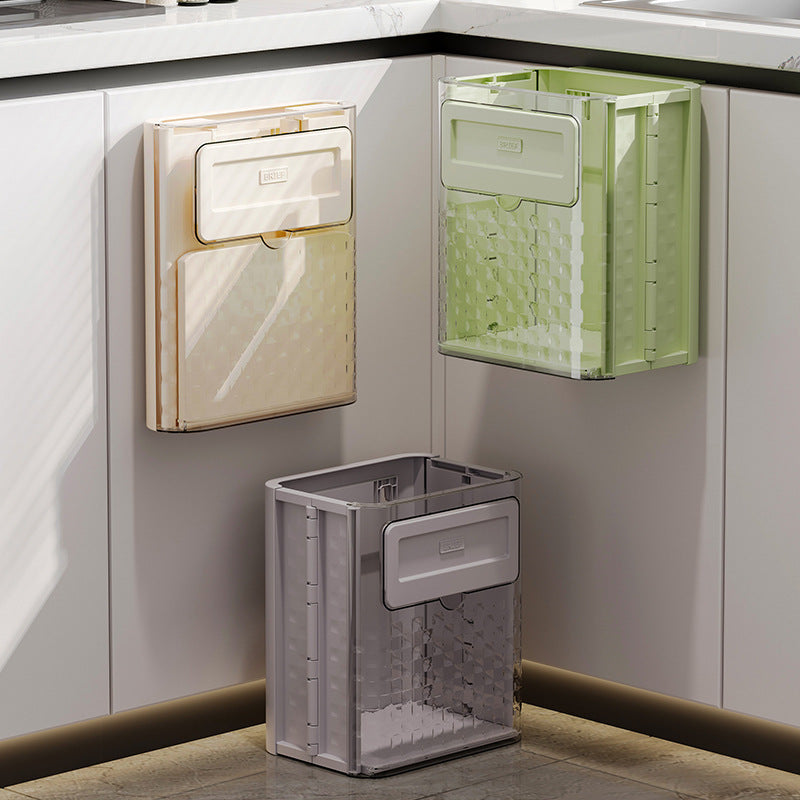 Foldable wall-mounted kitchen trash can for home use; made of plastic; installs with traceless adhesive.