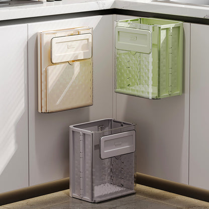 Foldable wall-mounted kitchen trash can for home use; made of plastic; installs with traceless adhesive.